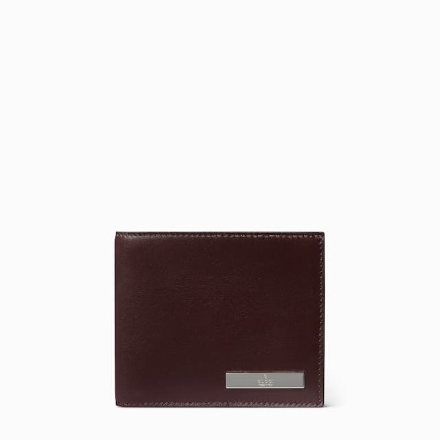 Gucci Bi-fold wallet with metal tag£415
