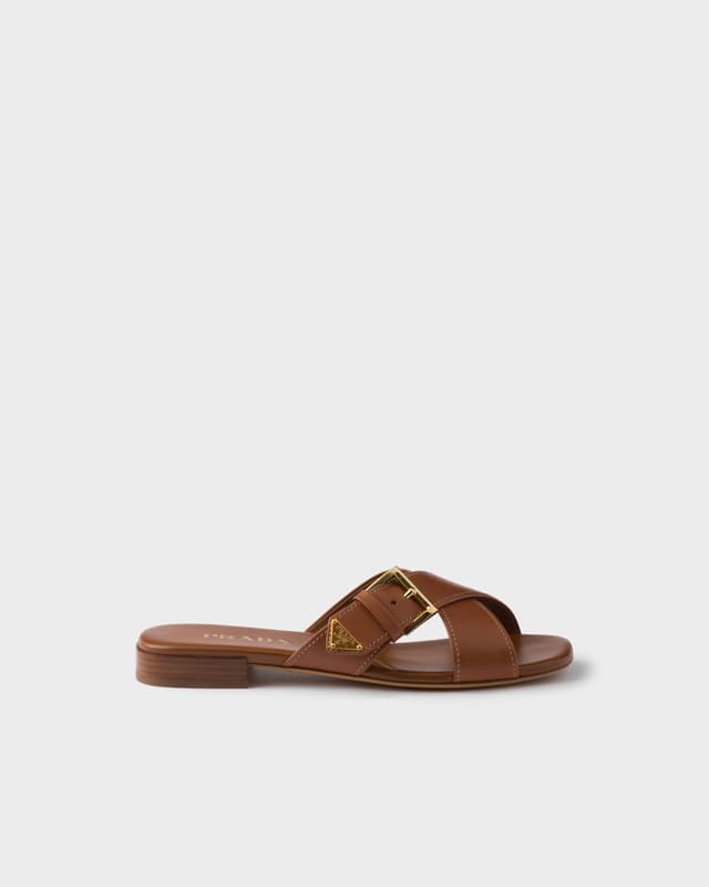 Prada Leather crisscross slides with buckle