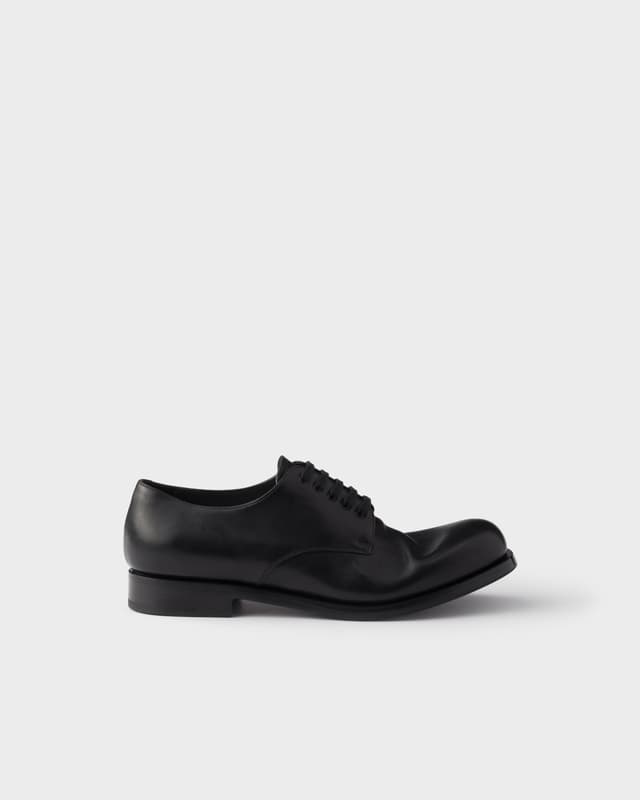 Prada Antiqued leather laced derby shoes
