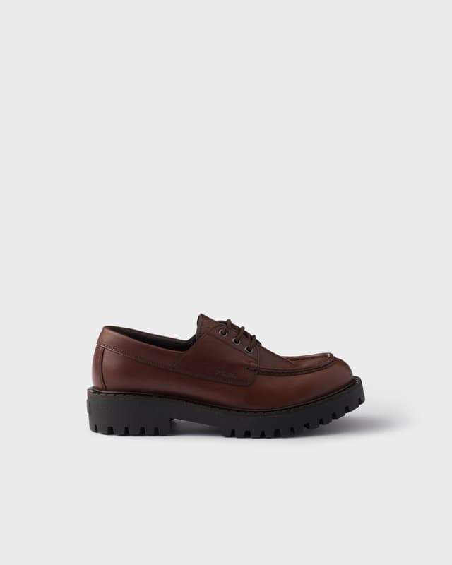 Prada Laced leather loafers